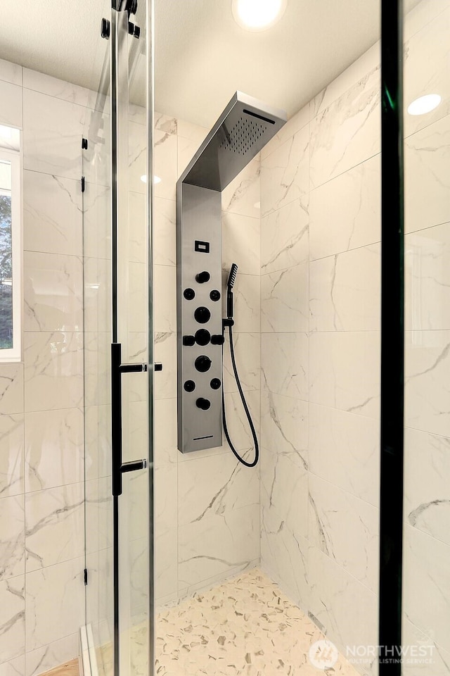 9630 SE Driftwood Dr, Port Orchard, WA 98367 - bathroom featuring a marble finish shower