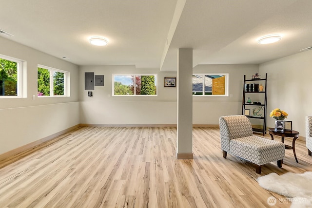 9630 SE Driftwood Dr, Port Orchard, WA 98367 - living area with light wood-style flooring, baseboards, and electric panel