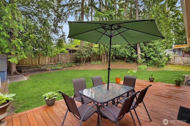 wooden deck with outdoor dining space