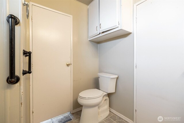 3701 Gun Club Rd Unit 16, Yakima, WA 98901 - bathroom featuring toilet, baseboards, and tile patterned floors