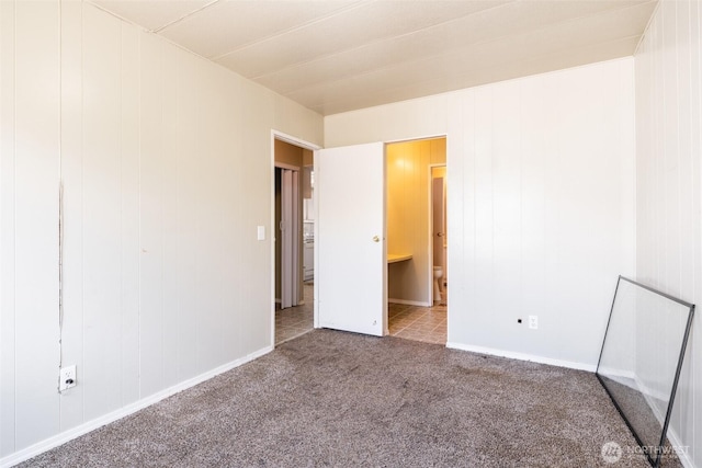 3701 Gun Club Rd Unit 16, Yakima, WA 98901 - unfurnished bedroom featuring carpet, baseboards, and connected bathroom