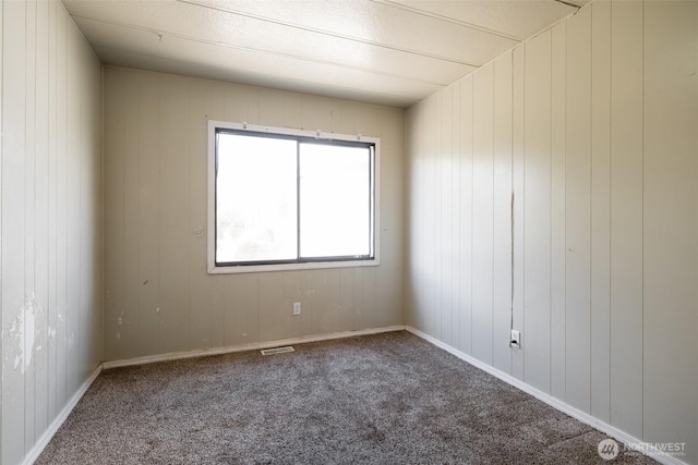 3701 Gun Club Rd Unit 16, Yakima, WA 98901 - carpeted spare room with healthy amount of natural light and wood walls