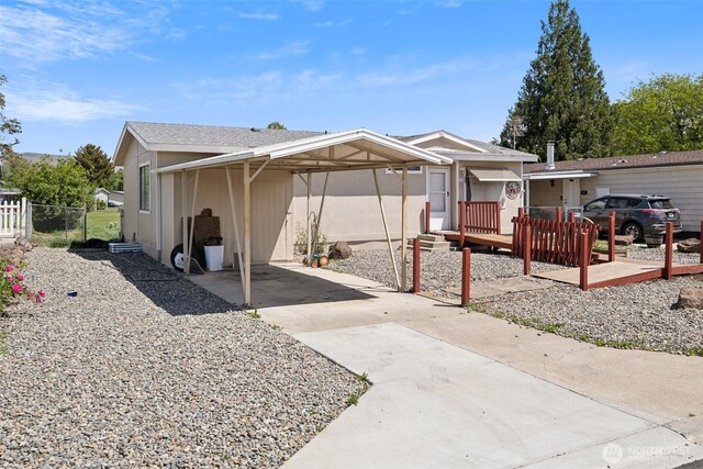 3701 Gun Club Rd Unit 16, Yakima, WA 98901 - back of house featuring driveway, fence, and a carport