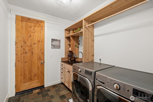8607 436th Ave SE, North Bend, WA 98045 - laundry room featuring cabinet space, washer and dryer, stone finish flooring, and baseboards