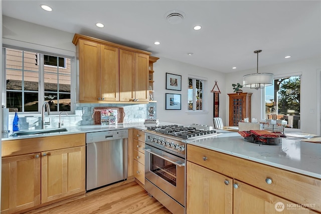 kitchen featuring stainless steel appliances, a sink, recessed lighting, open shelves, and light brown cabinets