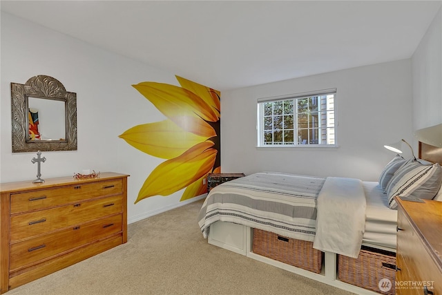 carpeted bedroom featuring baseboards