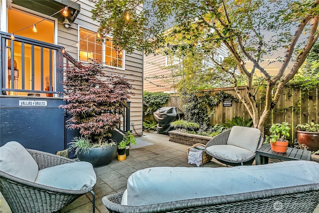 view of patio / terrace featuring grilling area and fence
