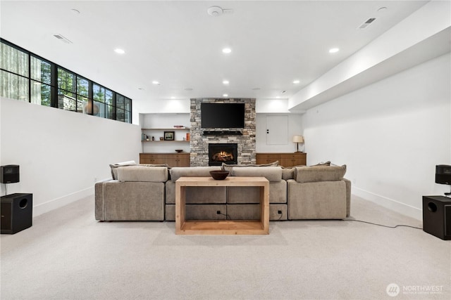 1501 Kokanee Loop, Cle Elum, WA 98922 - living area featuring carpet, baseboards, a stone fireplace, and recessed lighting