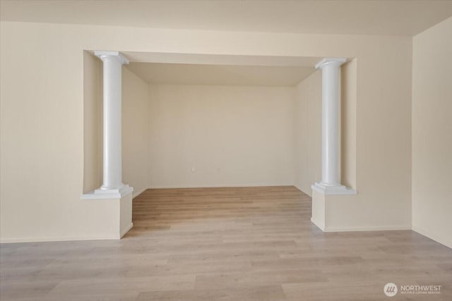 spare room featuring wood finished floors