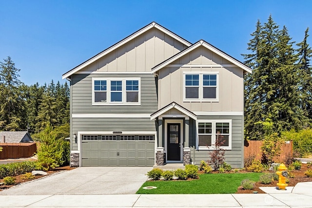 11434 SE 84th St Unit 34, Newcastle, WA 98056 - craftsman inspired home with fence, board and batten siding, an attached garage, driveway, and stone siding