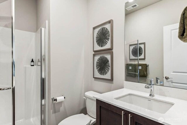 11434 SE 84th St Unit 34, Newcastle, WA 98056 - bathroom with toilet, a stall shower, and vanity