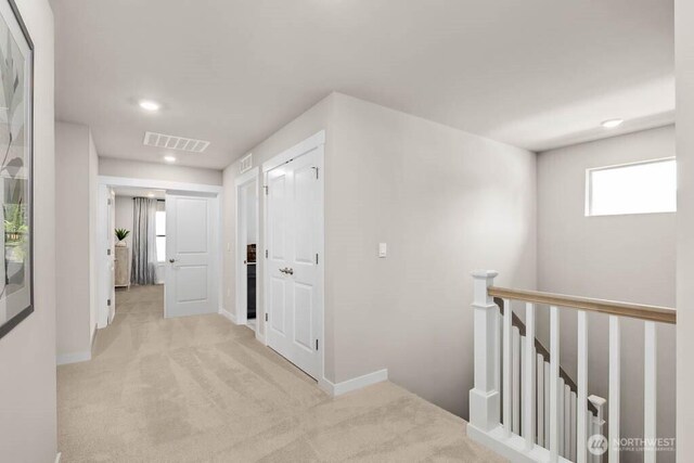 11434 SE 84th St Unit 34, Newcastle, WA 98056 - hall with an upstairs landing, light carpet, recessed lighting, and baseboards