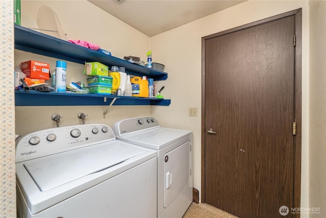 clothes washing area with washing machine and dryer