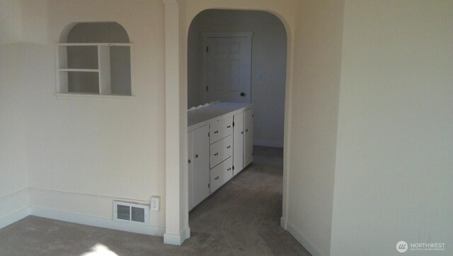 4815 S J St, Tacoma, WA 98408 - corridor with carpet floors, arched walkways, and baseboards