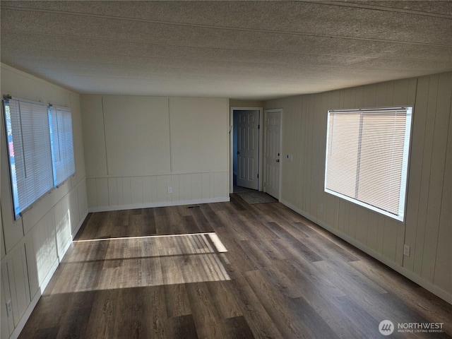 17925 Jordan St SW, Rochester, WA 98579 - unfurnished room with wood finished floors and a decorative wall