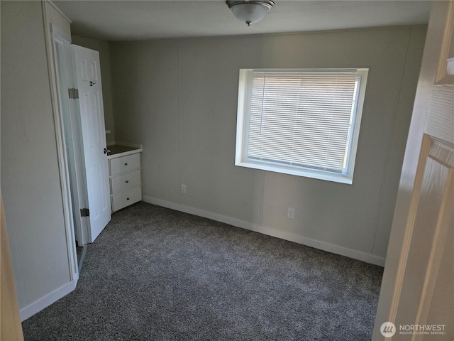 17925 Jordan St SW, Rochester, WA 98579 - unfurnished bedroom featuring dark carpet and baseboards