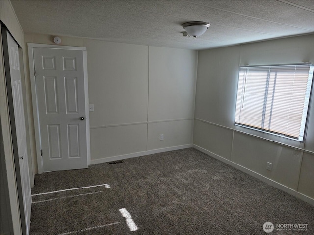 17925 Jordan St SW, Rochester, WA 98579 - carpeted empty room with a textured ceiling and baseboards