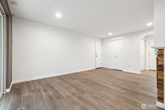35010 45th Ave S, Auburn, WA 98001 - empty room with recessed lighting, light wood finished floors, and baseboards