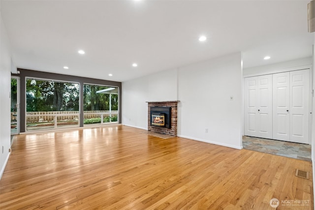 35010 45th Ave S, Auburn, WA 98001 - unfurnished living room featuring light wood-style floors, recessed lighting, a fireplace, and baseboards