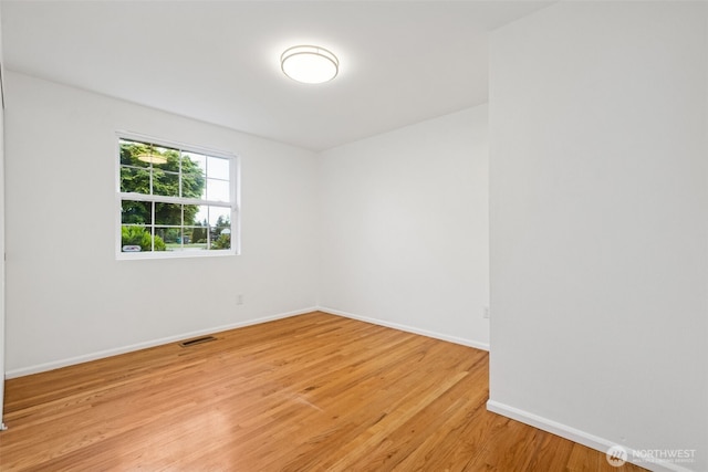 35010 45th Ave S, Auburn, WA 98001 - unfurnished room with light wood finished floors and baseboards