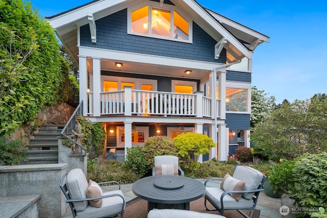 1712 Arch Ave SW, Seattle, WA 98116 - back of house featuring stairway, a patio area, and a balcony