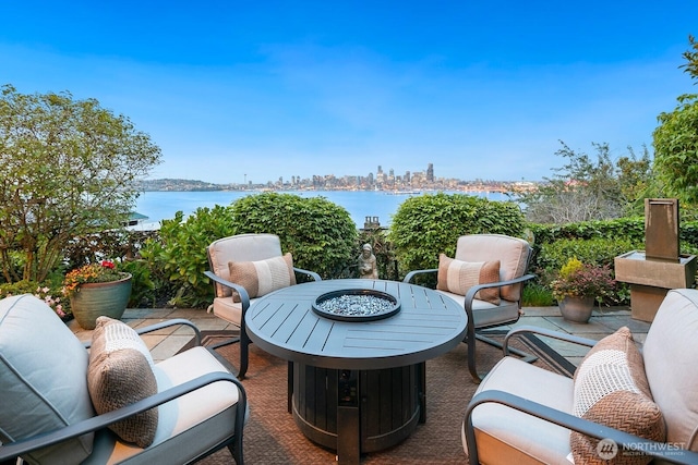 1712 Arch Ave SW, Seattle, WA 98116 - view of patio featuring a fire pit and a water view