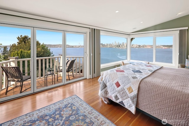 1712 Arch Ave SW, Seattle, WA 98116 - bedroom with a water view, access to exterior, lofted ceiling, wood finished floors, and multiple windows