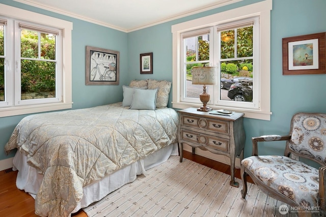 1712 Arch Ave SW, Seattle, WA 98116 - bedroom featuring wood finished floors, crown molding, and baseboards