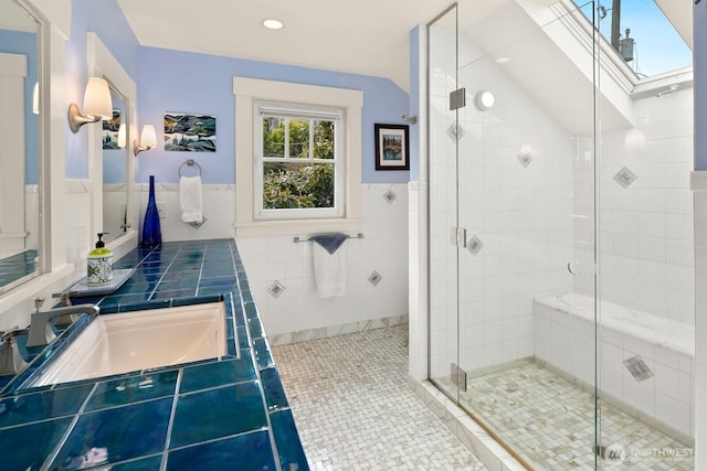 1712 Arch Ave SW, Seattle, WA 98116 - full bathroom featuring a sink, tile walls, a stall shower, lofted ceiling, and tile patterned flooring