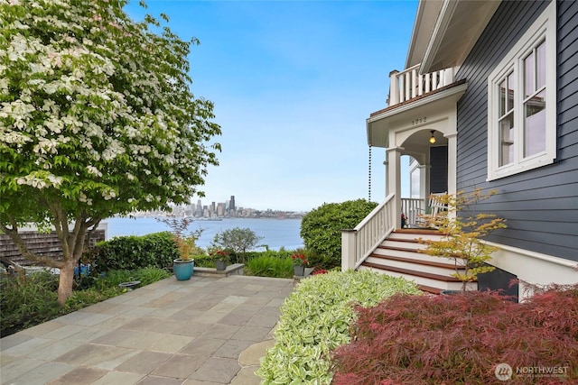 1712 Arch Ave SW, Seattle, WA 98116 - view of patio with a water view and a balcony