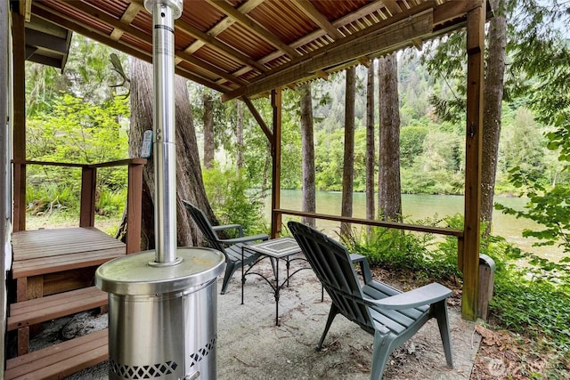 sunroom / solarium with a water view