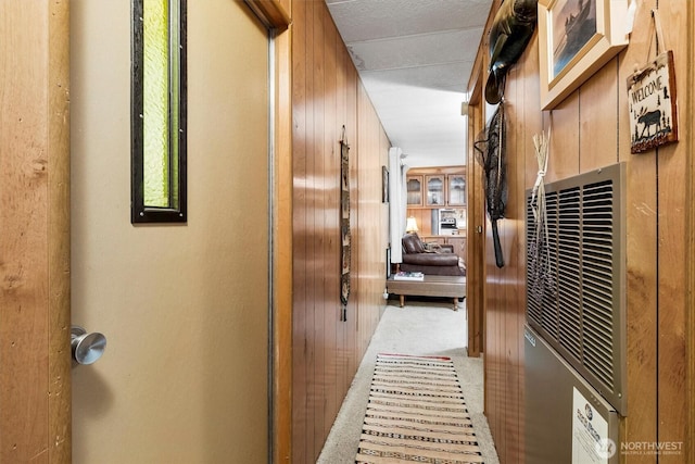 corridor with wooden walls and carpet