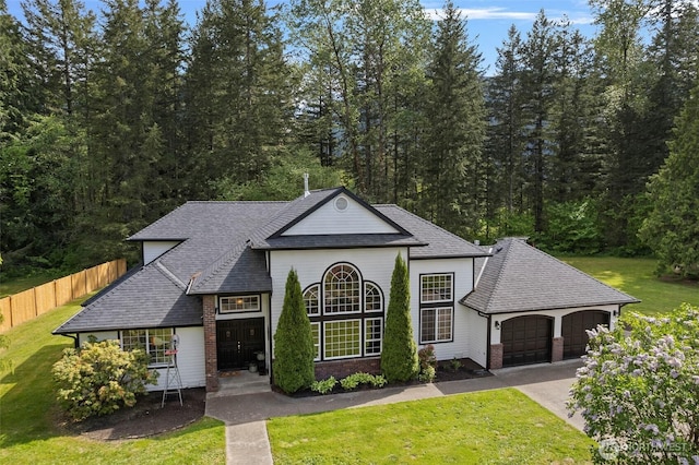 8235 Lusk Rd, Concrete, WA 98237 - view of front facade with a garage, concrete driveway, roof with shingles, and brick siding