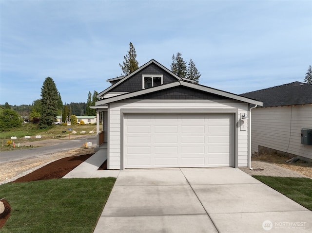 11 E Compass Ln, Allyn, WA 98524 - garage featuring driveway