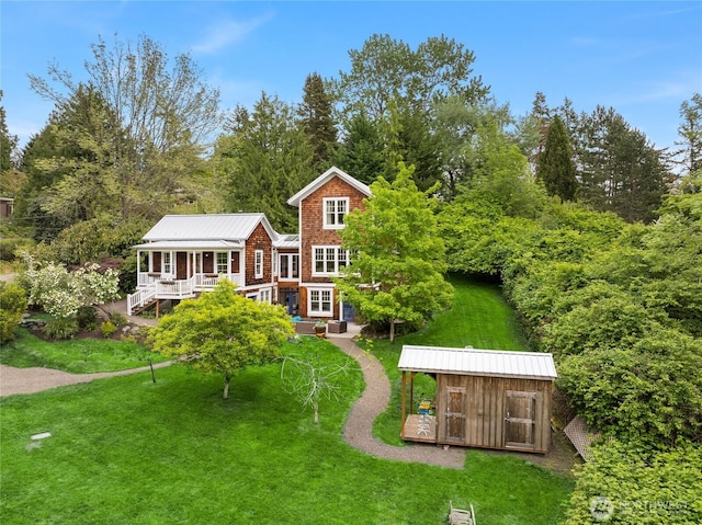 8285 NE Beck Rd, Bainbridge Island, WA 98110 - rear view of house with a yard, an outbuilding, a deck, and a shed