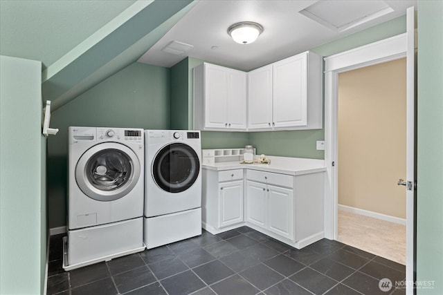 12916 318th Ave NE, Duvall, WA 98019 - laundry room with washing machine and clothes dryer, dark tile patterned floors, cabinet space, baseboards, and attic access