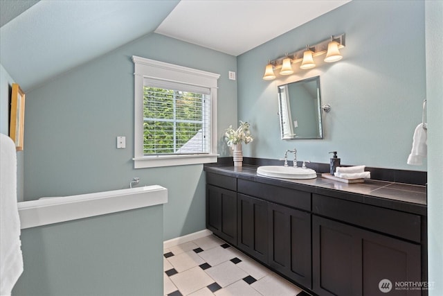 12916 318th Ave NE, Duvall, WA 98019 - bathroom with vanity, lofted ceiling, and tile patterned floors