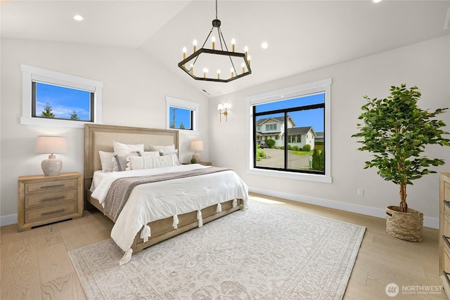 1750 Farmview Ter, Lynden, WA 98264 - bedroom featuring a chandelier, light wood-style flooring, vaulted ceiling, baseboards, and recessed lighting