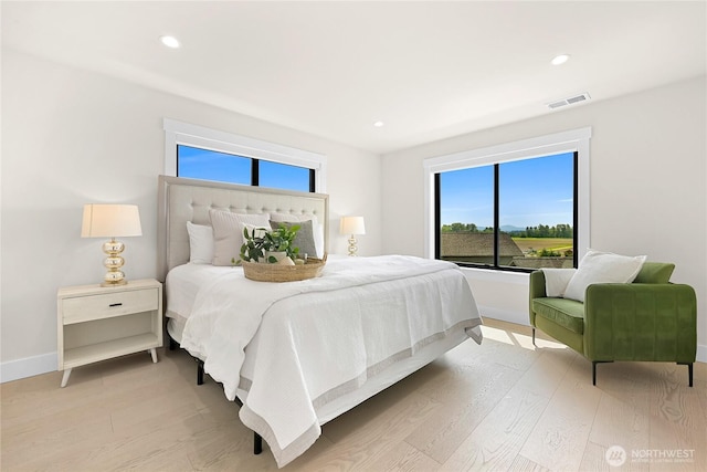 1750 Farmview Ter, Lynden, WA 98264 - bedroom featuring light wood-style flooring, multiple windows, baseboards, and recessed lighting