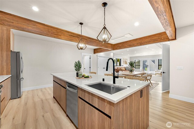 1750 Farmview Ter, Lynden, WA 98264 - kitchen with a sink, stainless steel appliances, open floor plan, baseboards, and modern cabinets