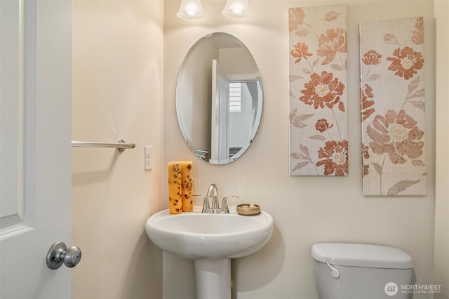 bathroom featuring toilet