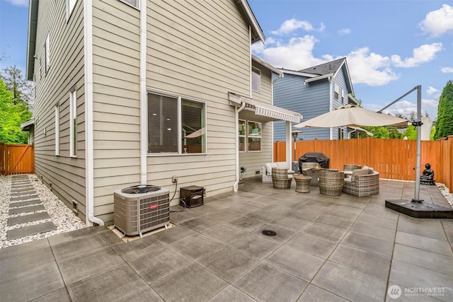 back of house with a patio, central AC unit, a fenced backyard, and an outdoor living space