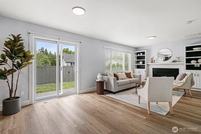 14908 93rd Ave E, Puyallup, WA 98375 - living area with plenty of natural light and wood finished floors