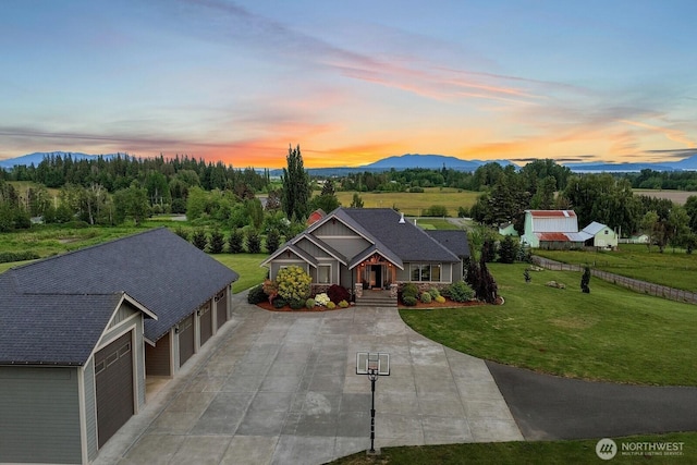 5754 W 26th Crst, Ferndale, WA 98248 - view of front facade with a yard, a garage, driveway, and a mountain view