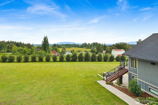 5754 W 26th Crst, Ferndale, WA 98248 - view of grassy yard with stairway and a mountain view
