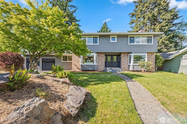 view of front of property with brick siding, a front lawn, and an attached garage