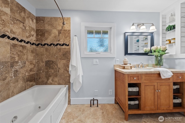 full bath featuring vanity, a combined bath / shower with jetted tub, and baseboards
