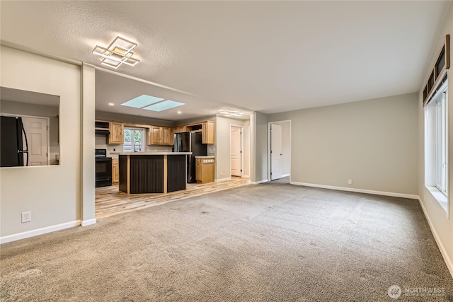 12814 NE 190th Pl, Bothell, WA 98011 - unfurnished living room with light colored carpet and baseboards