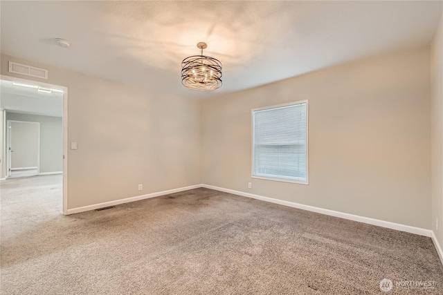 12814 NE 190th Pl, Bothell, WA 98011 - spare room featuring carpet floors, a chandelier, and baseboards