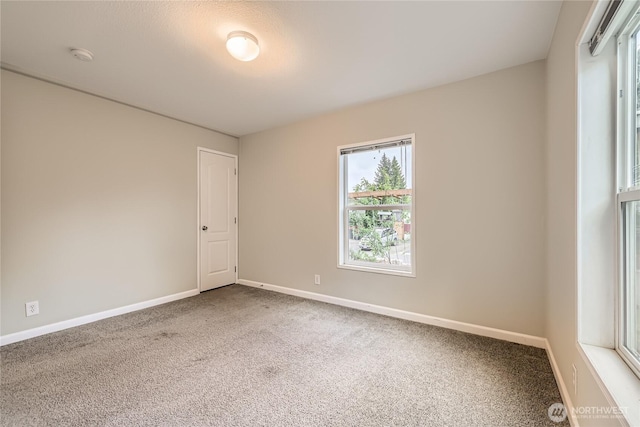 12814 NE 190th Pl, Bothell, WA 98011 - carpeted empty room with baseboards and a smoke detector